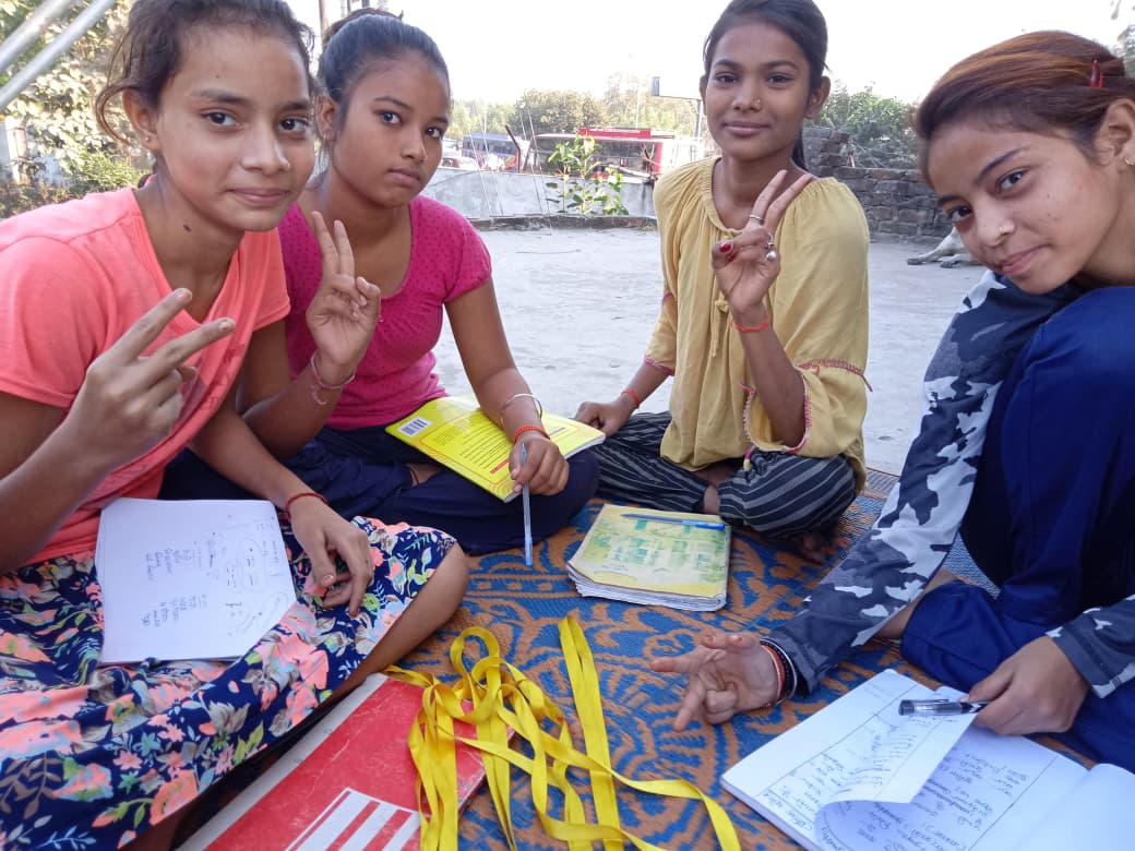 Women learning sewing skills